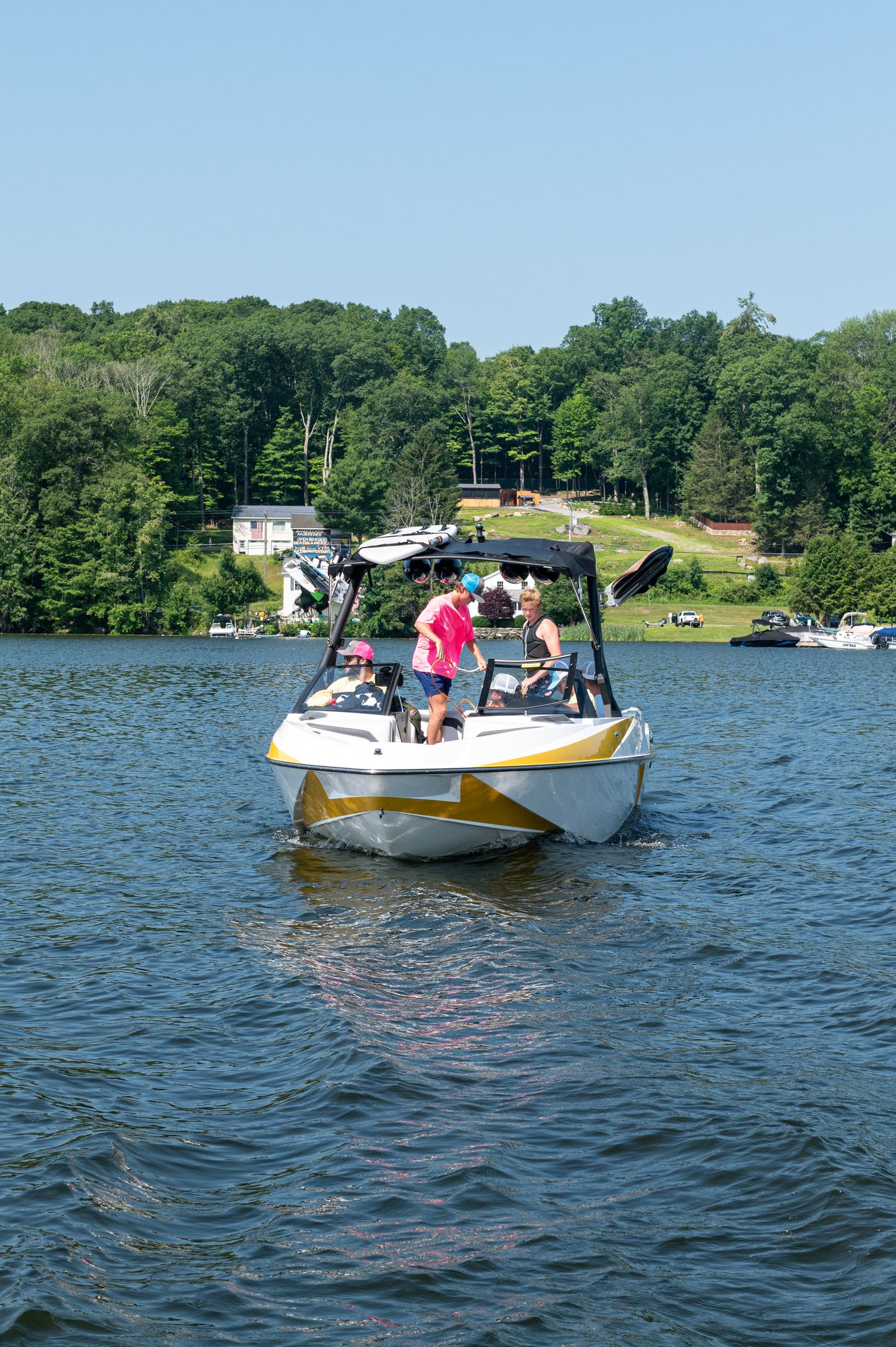 Guests laughing aboard a CT Water Sports charter boat