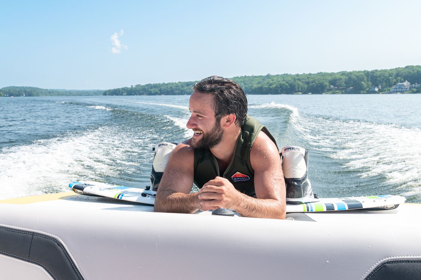 A guest enjoying a captained boat day on a Connecticut lake